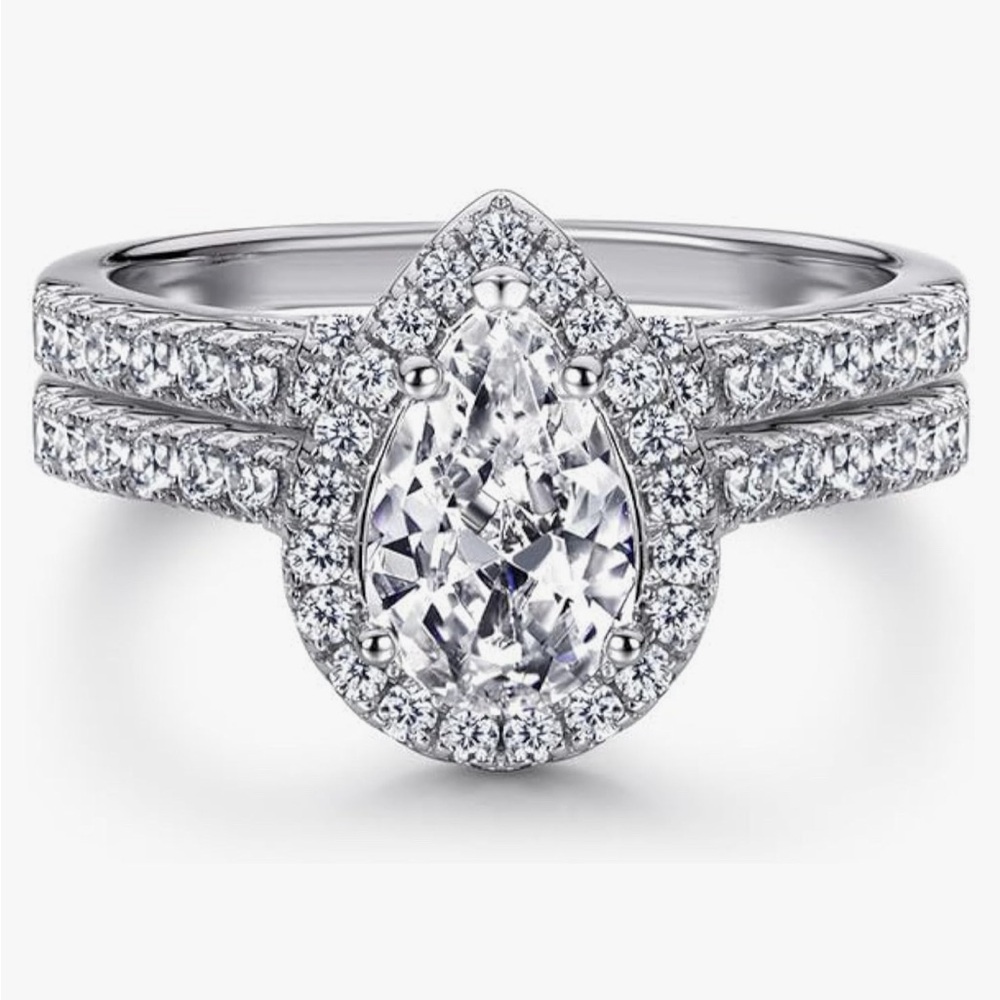Never worn, pear shaped wedding set. Moissanite set in 14k white gold. Size 6